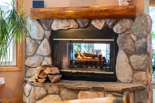 details with a stone fireplace