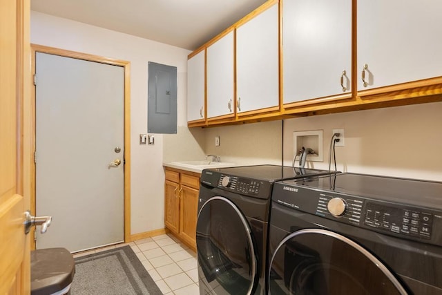 laundry room with sink, cabinets, electric panel, light tile patterned flooring, and washer and dryer