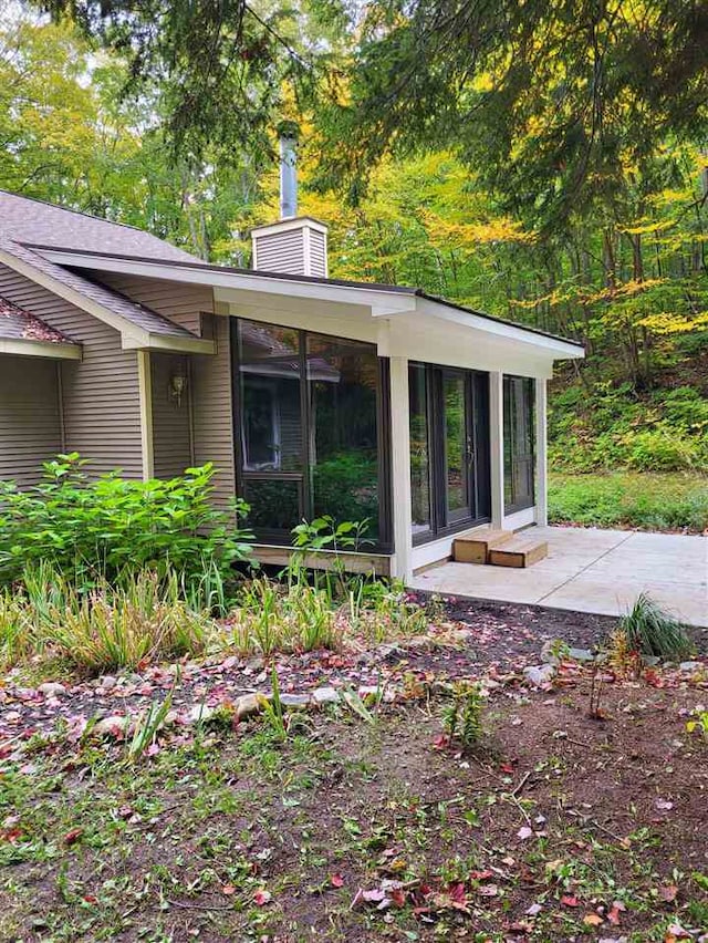 exterior space featuring a sunroom