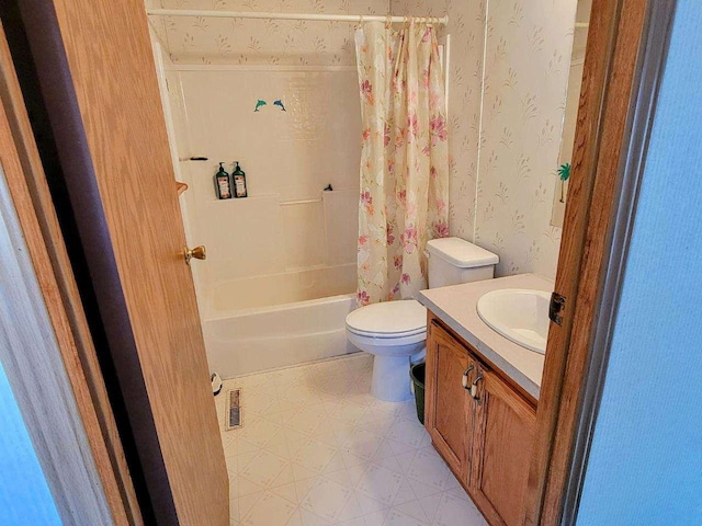 full bathroom with vanity, toilet, and shower / bath combo