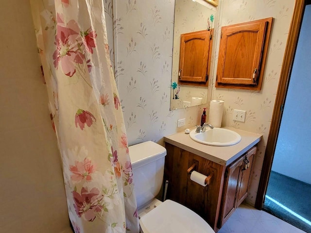 bathroom featuring vanity and toilet