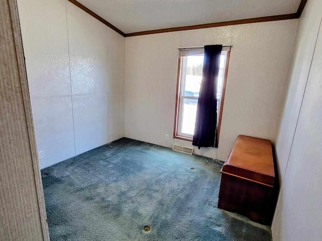 carpeted spare room with ornamental molding