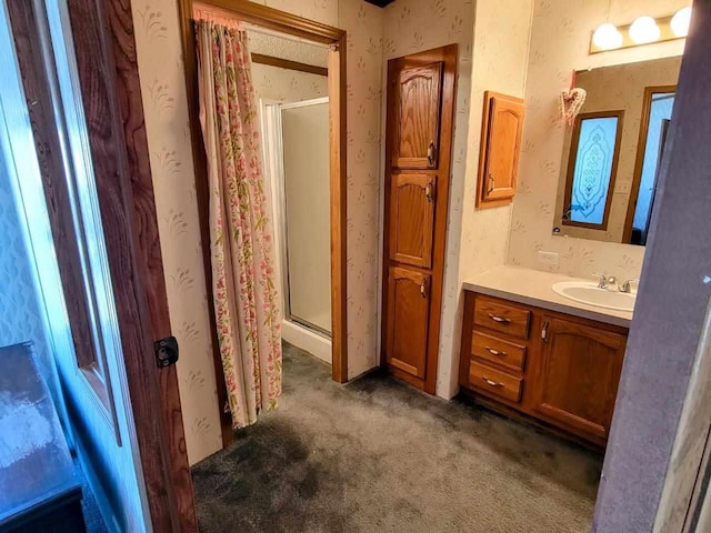 bathroom with a shower and vanity