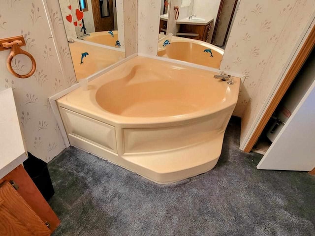 bathroom featuring a tub and vanity