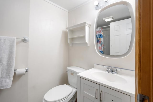 bathroom featuring vanity, toilet, walk in shower, and ornamental molding