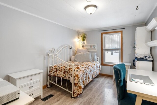 bedroom featuring light wood-type flooring