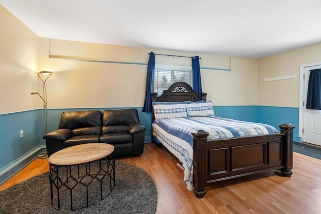 bedroom with hardwood / wood-style floors