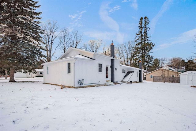 view of snow covered house