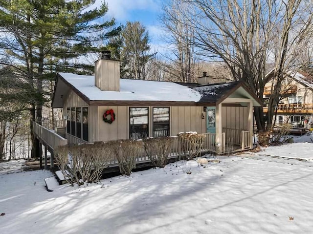 view of snow covered house