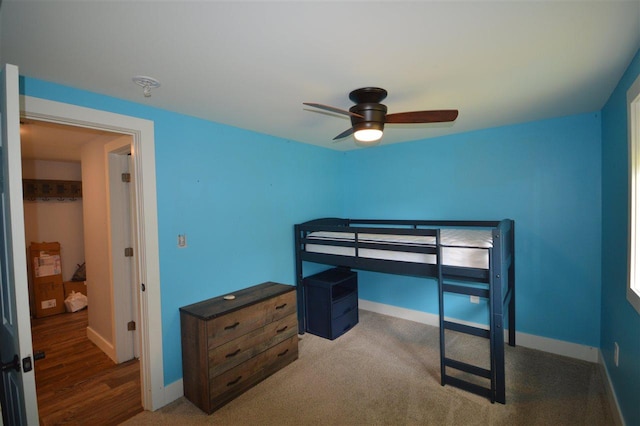 carpeted bedroom with ceiling fan