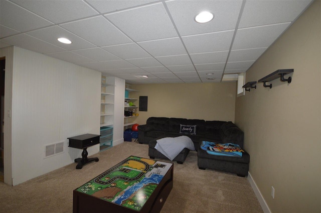 playroom with carpet flooring and a drop ceiling