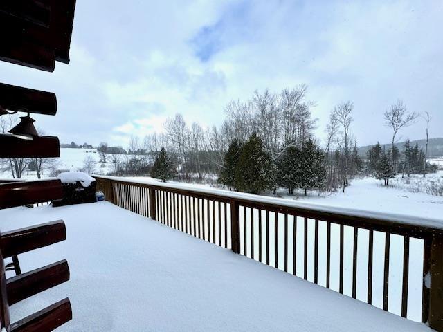 view of snow covered deck