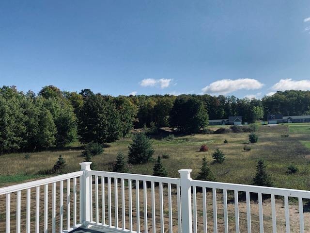 view of yard with a rural view