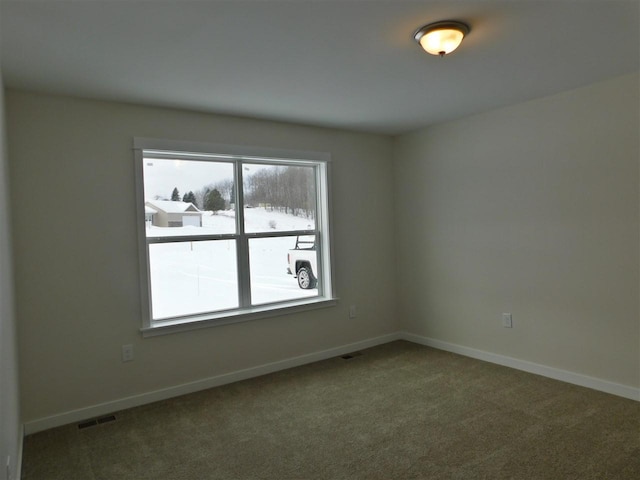 empty room featuring carpet flooring