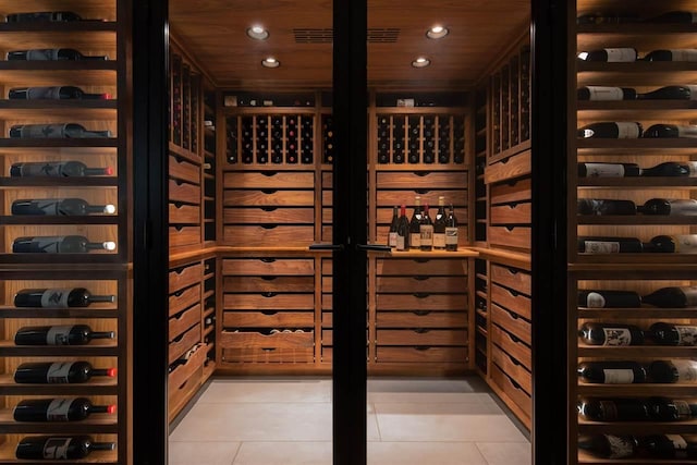 wine area with tile patterned flooring and wooden ceiling