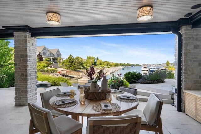 view of patio featuring a water view