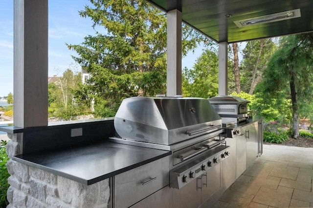 view of patio / terrace with an outdoor kitchen and grilling area