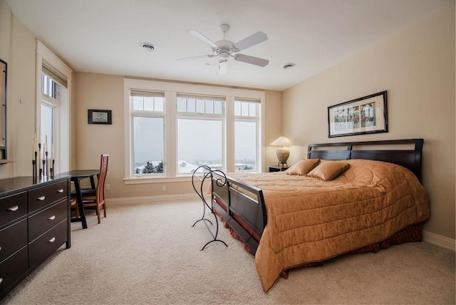 bedroom featuring ceiling fan and light colored carpet