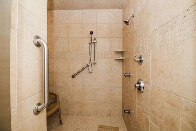 bathroom with a tile shower