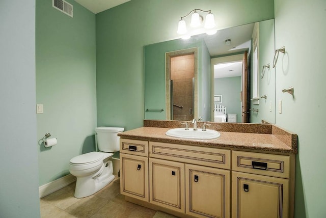 bathroom with walk in shower, tile patterned floors, vanity, and toilet