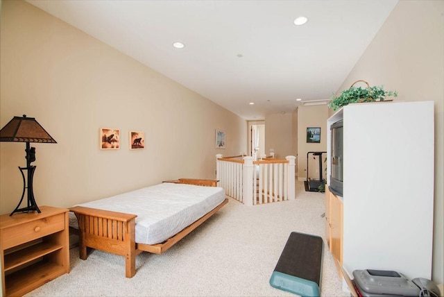 bedroom featuring light carpet