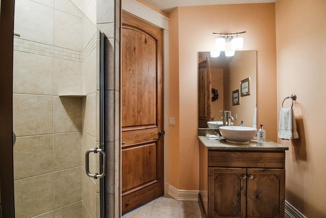 bathroom with an enclosed shower, tile patterned floors, and vanity