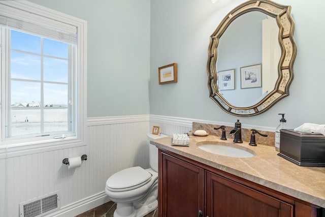 bathroom with toilet and vanity