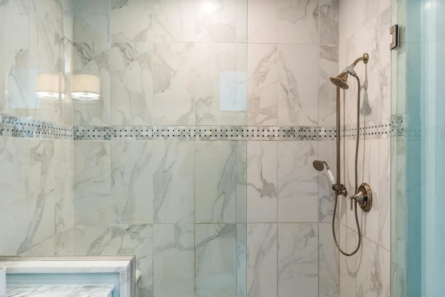 bathroom with a tile shower