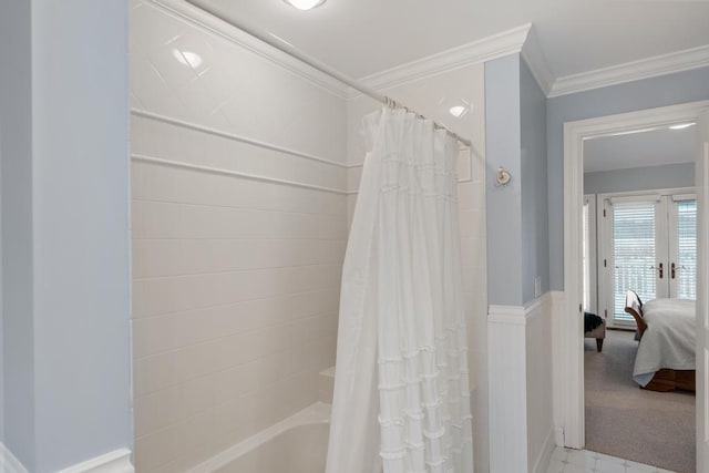 bathroom featuring shower / tub combo and crown molding