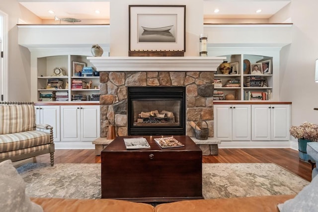 sitting room featuring a fireplace and light hardwood / wood-style flooring