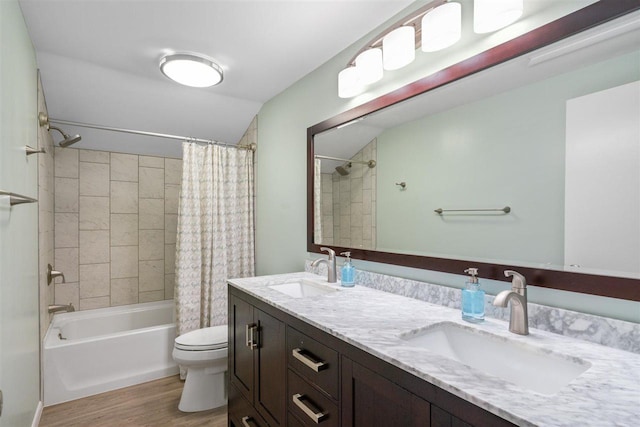 full bathroom featuring toilet, hardwood / wood-style flooring, vanity, and shower / bathtub combination with curtain