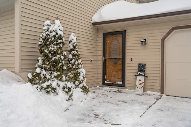 view of snow covered property entrance