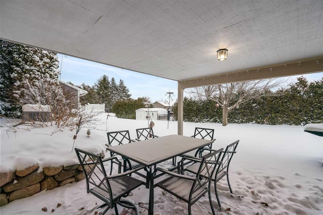 view of snow covered patio