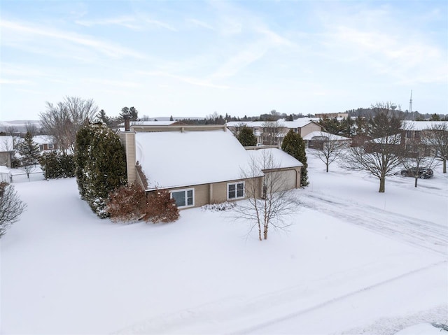 view of snow covered property