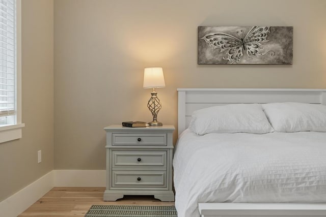 bedroom with light wood-type flooring