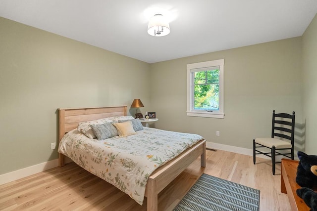 bedroom with light hardwood / wood-style floors