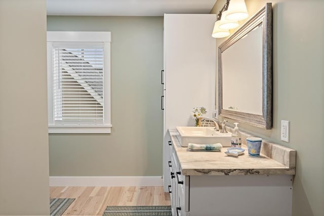 bathroom with wood-type flooring and vanity