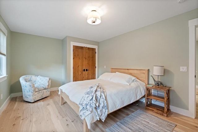 bedroom with light hardwood / wood-style flooring