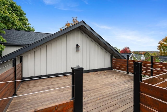 view of side of property with a wooden deck