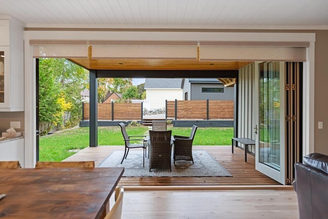 entryway featuring a wealth of natural light and wood-type flooring