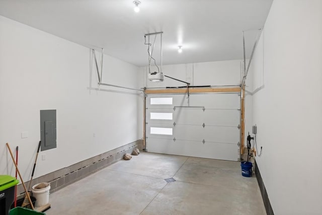 garage featuring electric panel and a garage door opener