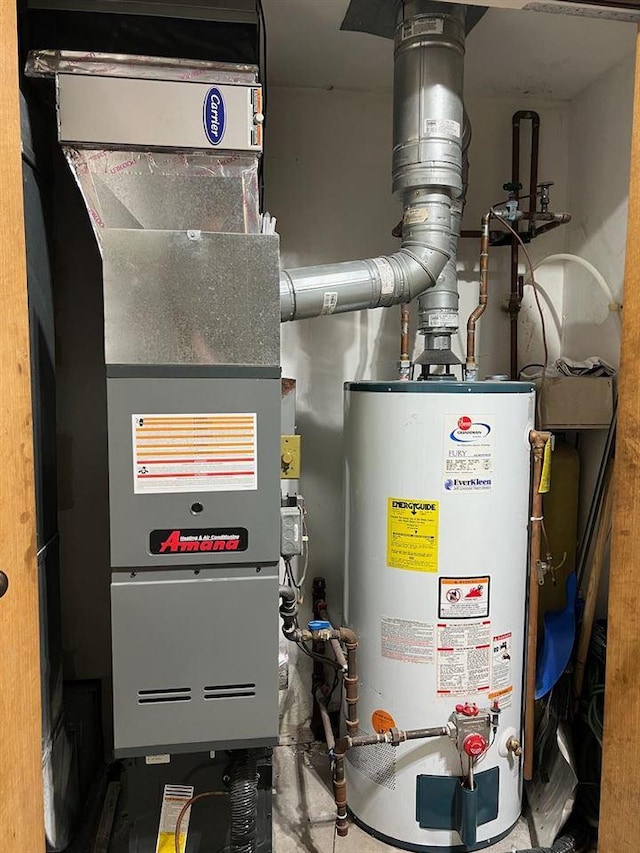 utility room featuring water heater