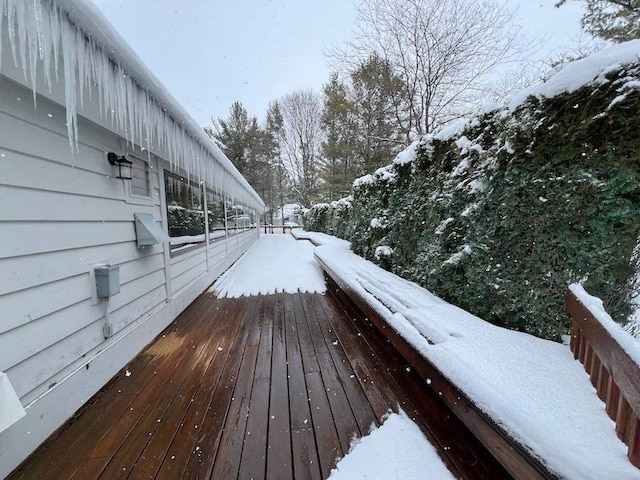 view of snow covered deck