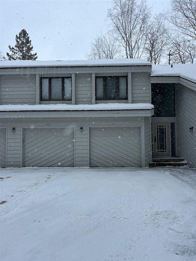 view of snow covered garage