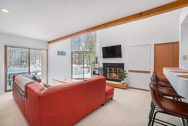 living room featuring light colored carpet and beamed ceiling