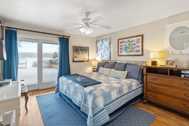 bedroom featuring ceiling fan, light hardwood / wood-style floors, and access to outside