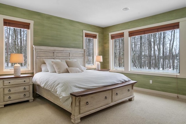 bedroom featuring light colored carpet