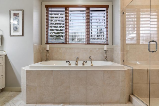 bathroom featuring tile patterned floors, vanity, and separate shower and tub