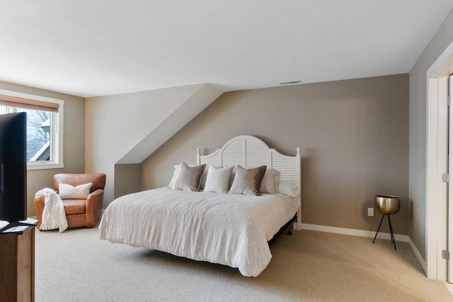 bedroom featuring light carpet