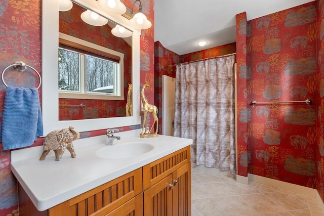 bathroom featuring vanity, tile patterned flooring, and a shower with curtain